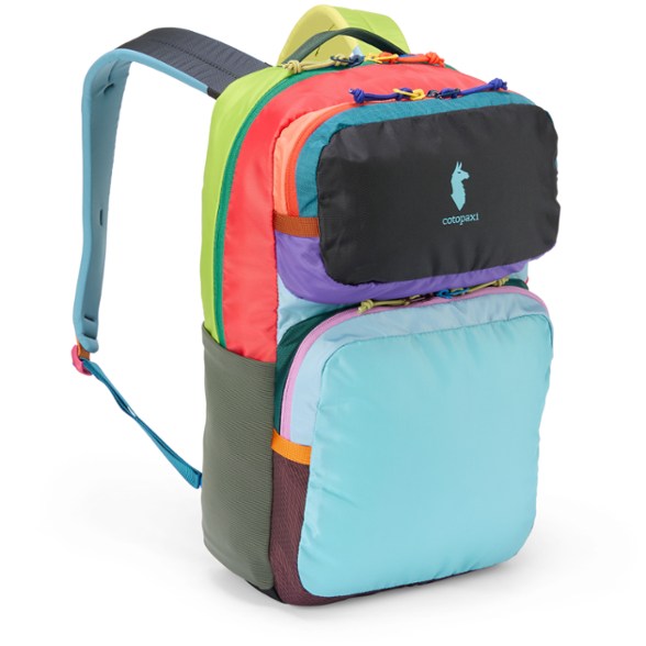 Cotopaxi backpack worn during urban commute, showing laptop sleeve and water bottle pockets