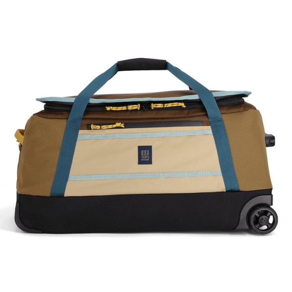 Side view of Topo Designs Mountain Roller Duffel showing wheels and handle