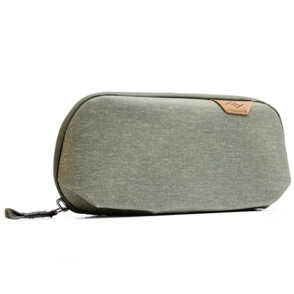 Compact tech organizer pouch shown open with various cables and chargers arranged inside, highlighting its multiple compartments.