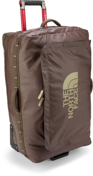 Base Camp Voyager 29-inch hard shell suitcase rolling through airport terminal
