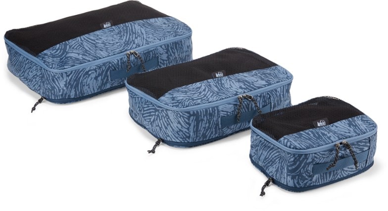 Expandable packing cubes set in various sizes with mesh top panels for travel organization