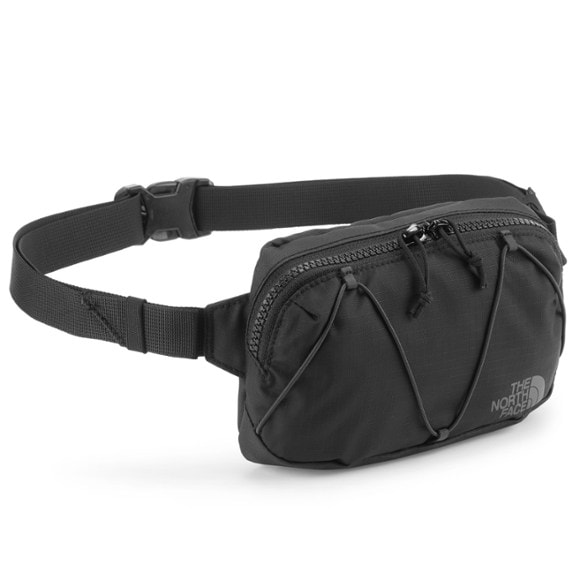 Front view of black waist pack showing zippered compartments and adjustable strap