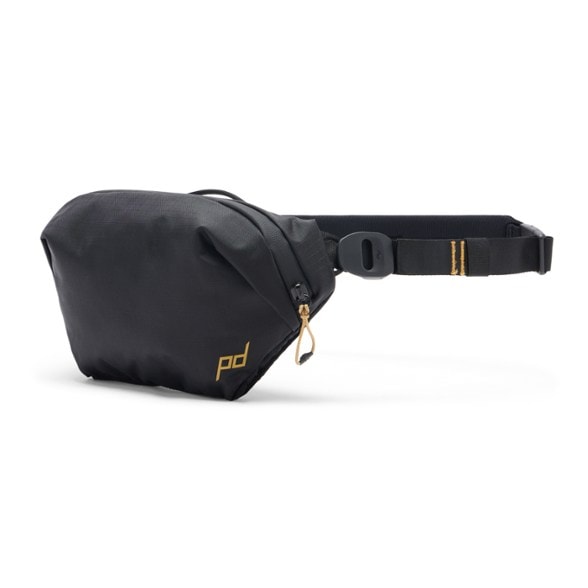 TerraSling 2L being used as a crossbody bag during travel