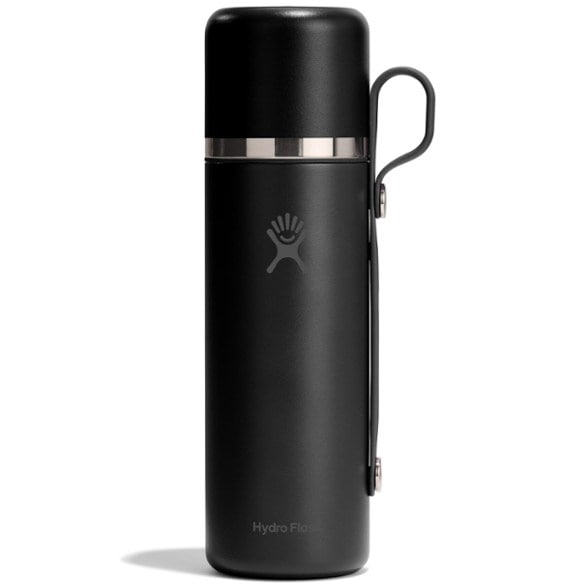 TrailMaster Pro insulated bottle with cup attached—shown in use at a campsite