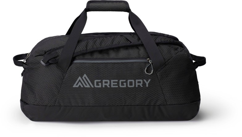 A person carrying the Expedition 40L duffel bag on their back, showcasing its comfortable backpack straps, perfect for a camping trip.
