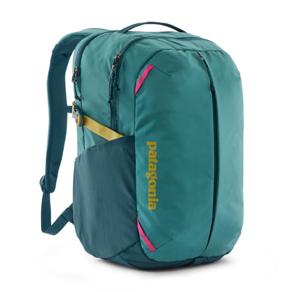 Patagonia Refugio 26L backpack side view, showing front pocket and side mesh pockets