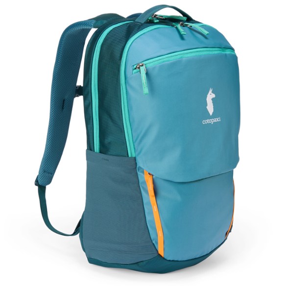 Side view of the Cotopaxi Allpa 26L Adventure Backpack showcasing its durable fabric and water bottle pockets.