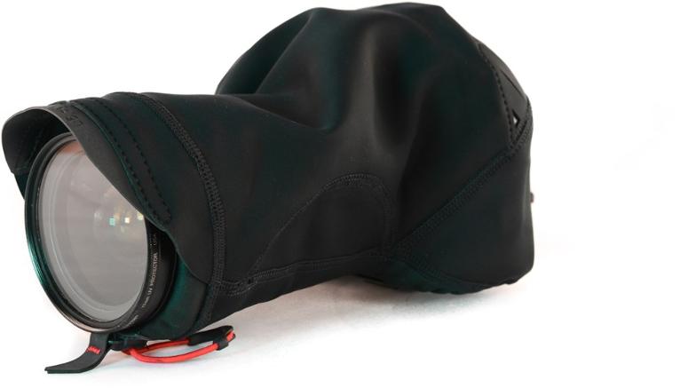 A Peak Design Shell camera cover shown on a DSLR, highlighting its waterproof features in an outdoor setting.