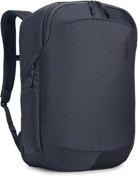 Thule Subterra 2 showcased as a backpack in urban setting with visible laptop compartment and stowable straps.
