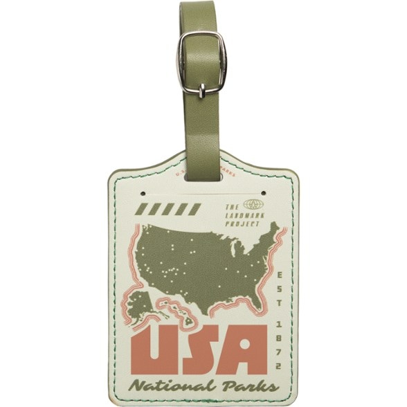 Vintage luggage tag showcasing weatherproof sticker and durable design.