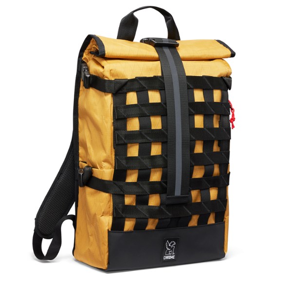 Close-up of Chrome Barrage 22L waterproof backpack showing roll-top closure and exterior cargo net