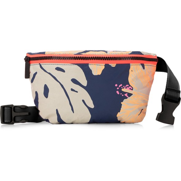 Aloha Mini Hip Pack worn crossbody during hiking, showing adjustable strap and compact size