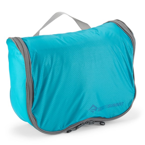 Ultimate Travel Hanging Toiletry Kit hanging in a bathroom with toiletries inside