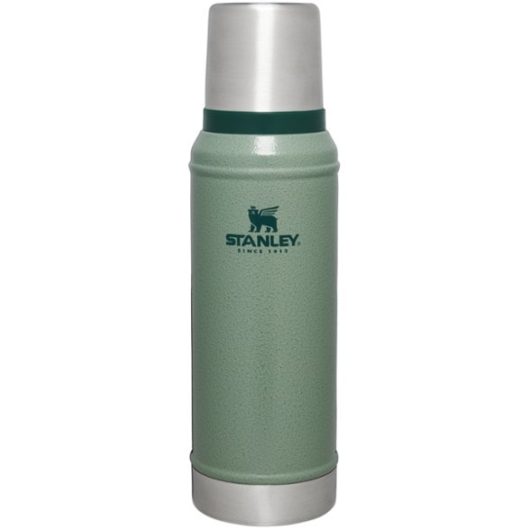 A person holding the Everest Trailblazer Insulated Bottle in a natural, outdoor setting, emphasizing its portability and sleek design.