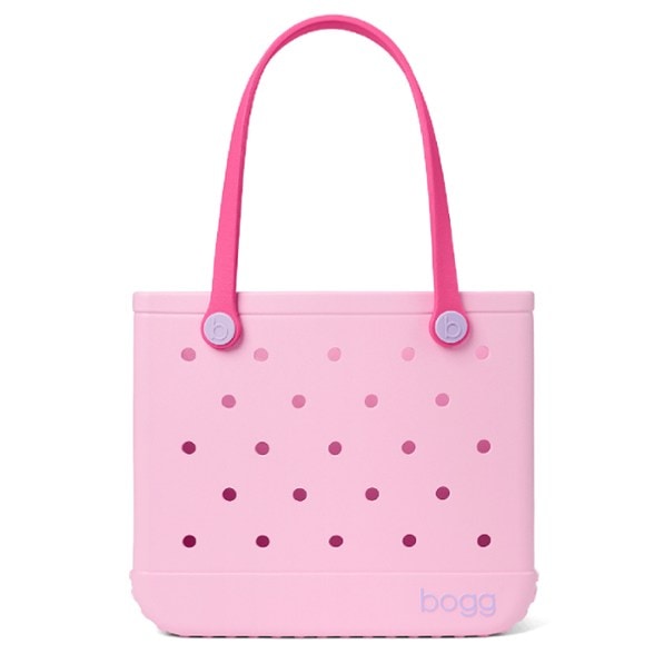 Compact travel baby bag in a stylish outdoor setting, showcasing its durable design.