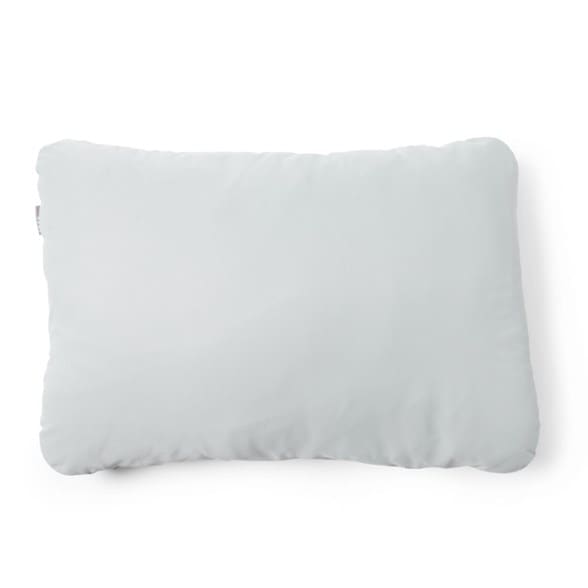 A HEST LuxeStretch Camp Pillowcase in a soft grey color, perfectly fitted onto a camping pillow, shown from a slightly elevated angle against a subtle outdoor background, highlighting its soft stretch fabric.
