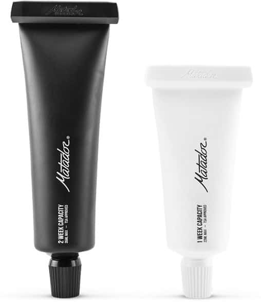 Matador Refillable Toothpaste Tube set, showing two sleek, empty tubes with caps off, highlighting their reusable design against a minimalist background.