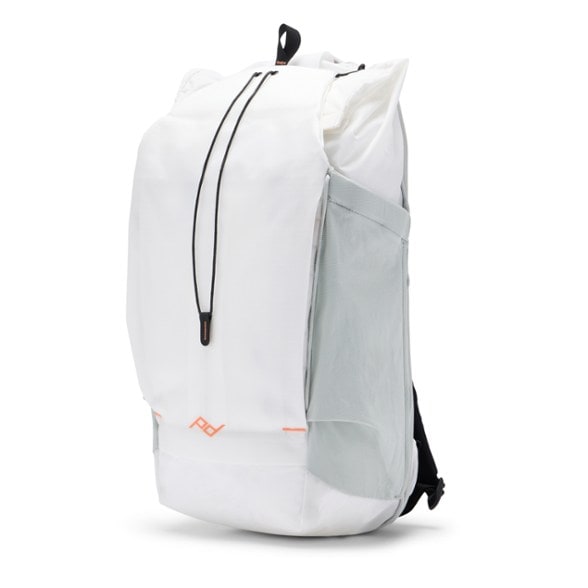 Peak Design TrailBlazer 25 Backpack in action on a hiking trail, showcasing its sleek design and versatility.