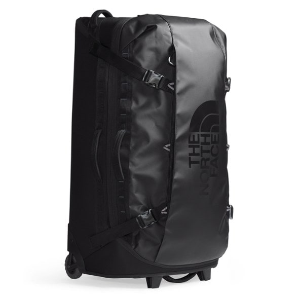 Durable Base Camp Adventure Rolling Duffel depicting ease of maneuvering at an airport.
