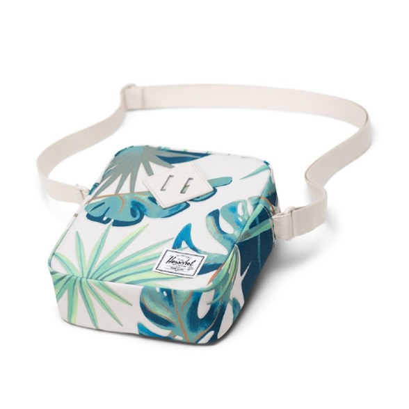 Heritage crossbody bag in use, showing adjustable strap and compact design