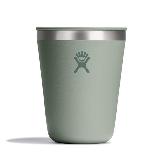 Hydro Flask Adventure Tumbler in a camping scene, showcasing its sleek design and cup holder compatibility.