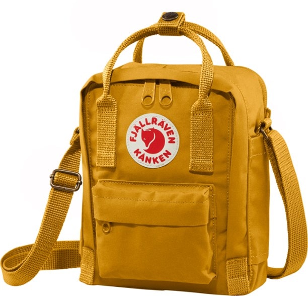 Fjallraven Kanken Sling Bag worn crossbody by a woman in a park