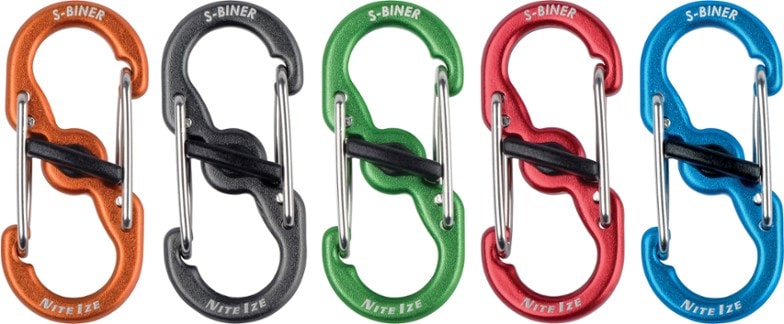 Close-up angle showing aluminum carabiner keychain with twist lock secured around three keys