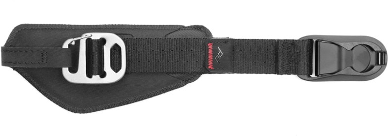 Peak Design Clutch 3.0 hand strap attached to a DSLR camera, showing adjustable grip in outdoor light