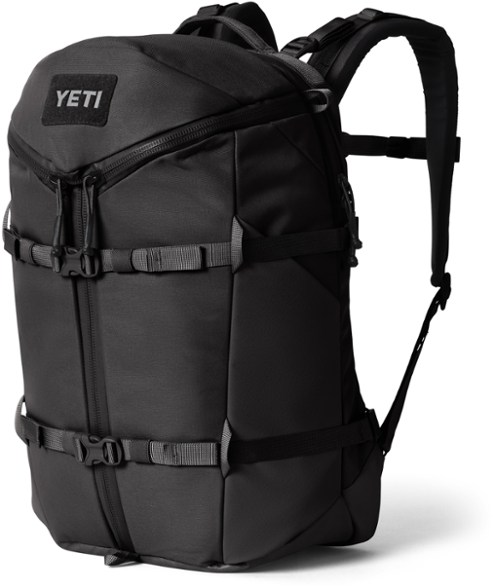 Side view of the YETI Ranchero Weekend Travel Backpack showcasing the RipZip Opening and multifunctional pockets.