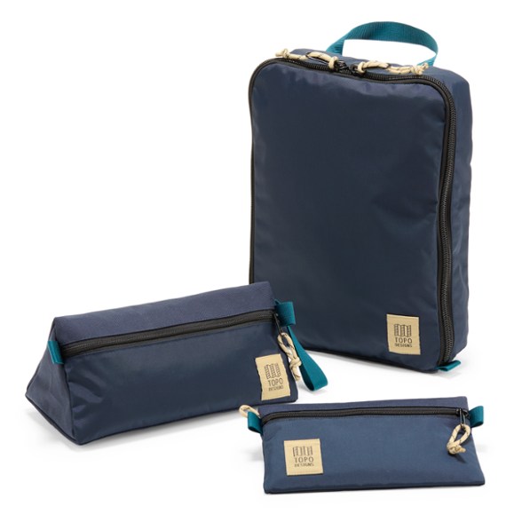 Close-up of travel accessory organizers showcasing zippers and fabric texture.