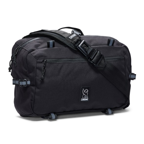 Chrome Kadet Max sling bag in a vibrant setting, showcasing its features and exterior pockets.