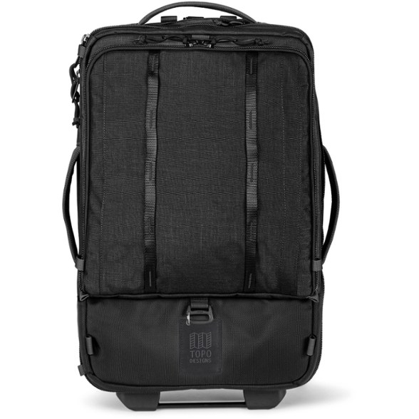 Topo Designs Global Travel Roller in midnight black, showing backpack straps and telescoping handle