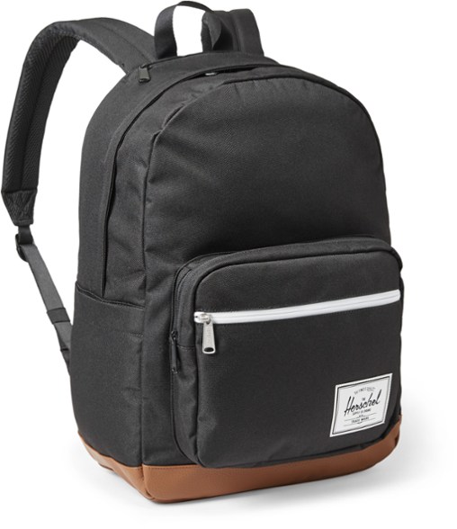 EcoCommute Pro Backpack from Herschel Supply Co. displayed on a city park bench.