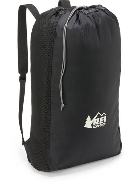 Ultralight laundry backpack worn by a traveler in a hostel