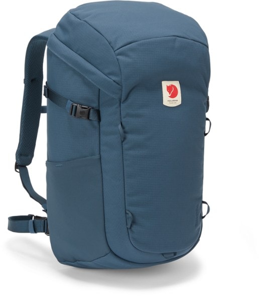 Fjallraven Ulvo 30 Adventure Backpack with laptop sleeve shown in hiking terrain.