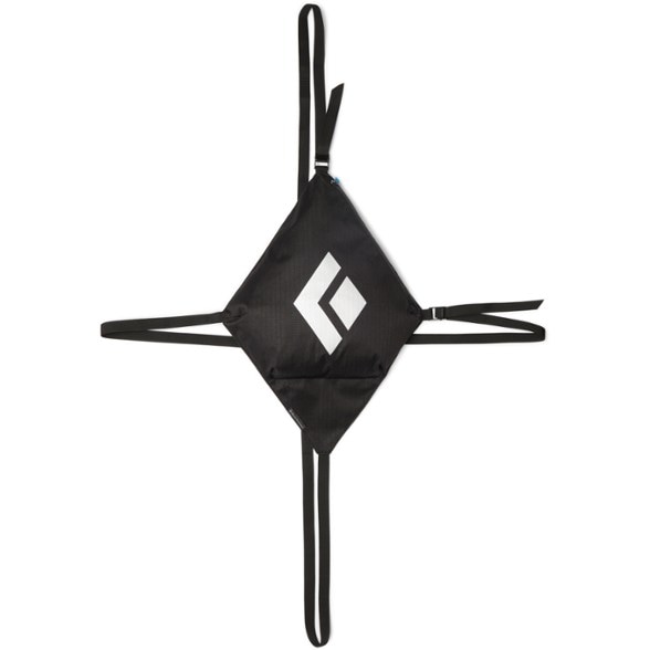 Front view of PadLink carrying system securing two climbing pads with buckle detail