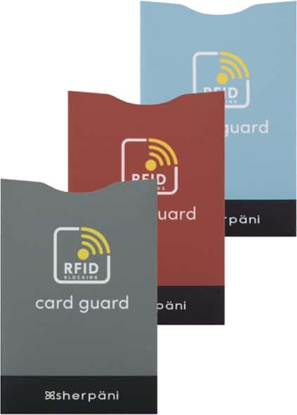 Sherpani RFID credit card sleeves in hand, showing slim profile for travel