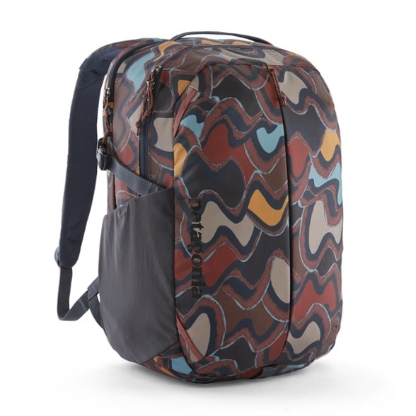 Patagonia Refugio 26L backpack showing organized compartments and laptop sleeve from a side angle.