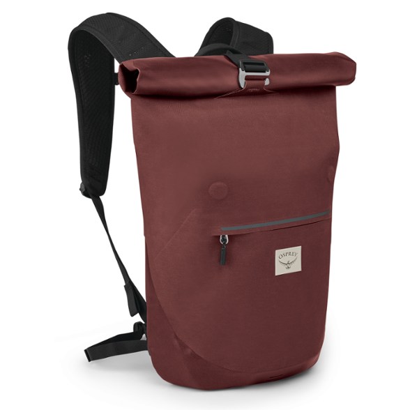 Osprey Arcane roll-top backpack in black, showing waterproof closure and urban commuter wearing it crossbody