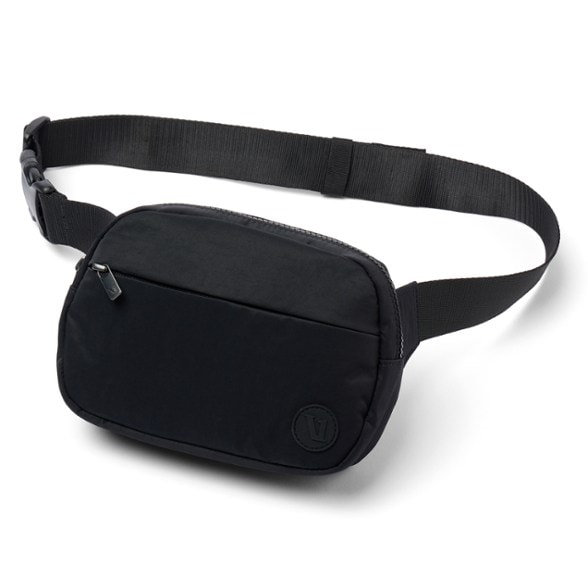Vuori Explorer waist bag worn casually, showcasing adjustable strap and multiple compartments
