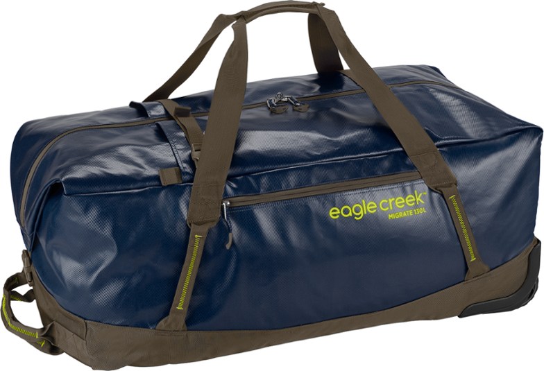 Front view of Eagle Creek Migrate 130L wheeled duffel showing water-resistant fabric and large wheels