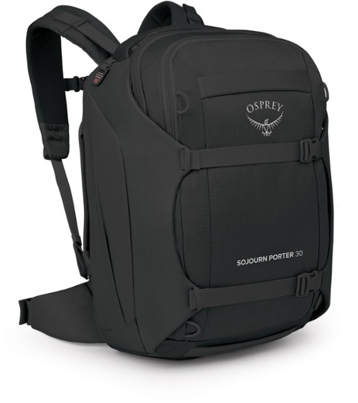 Osprey Sojourn Porter 30 travel pack shown in black, open to reveal interior mesh pockets