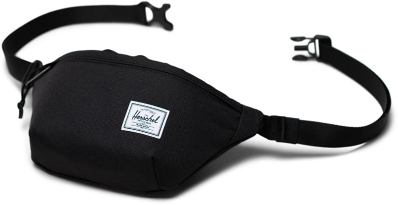 Herschel Classic Hip Pack worn crossbody with phone and wallet visible