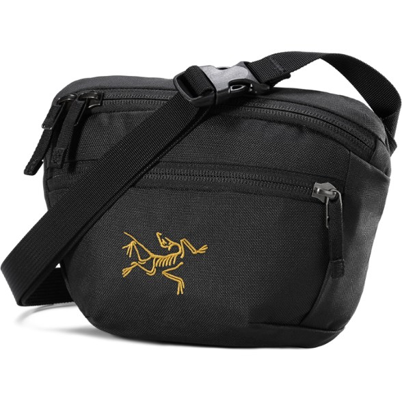 Mantis 1 waist pack worn crossbody during hiking, showing adjustable strap and front pocket access