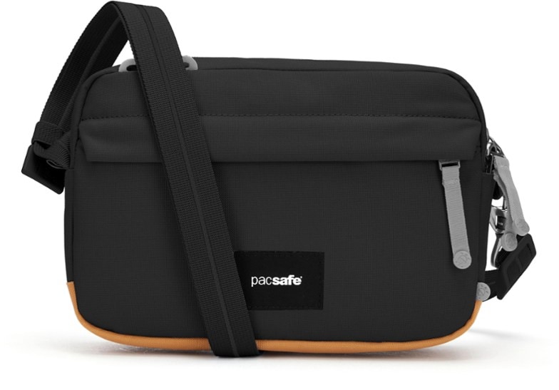 Pacsafe SecureTravel Crossbody Bag in use, showcasing its anti-theft features and spacious interior.