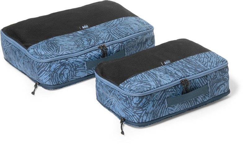 TravelMaster Expandable Packing Cube Set in use, showing organization and compression