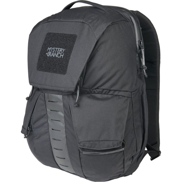 Front angle of Mystery Ranch Rip Ruck 24 Travel Pro Backpack, showcasing MOLLE webbing and zip compartments