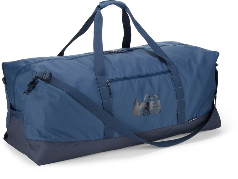 Eco-Travel Pro 140 duffel bag displayed outdoors with gear attached, highlighting its durability.