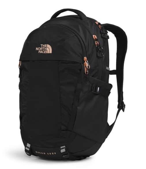 North Face Recon Luxe backpack worn by a woman, showcasing ergonomic straps and laptop compartment