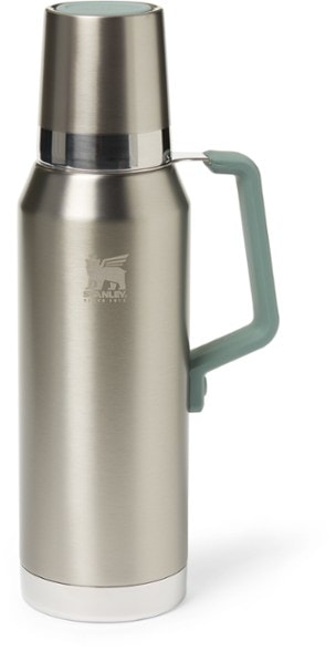 Forge 1.4L Vacuum Insulated Bottle in a hiking setting, showcasing its rugged design and practical use.